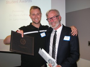 Distiguished Graduate Student awardee, Tyler Kae, and Dr. Larry George 