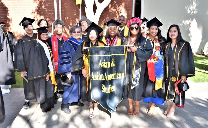AAAS commencement department photo with banner.                                                                  