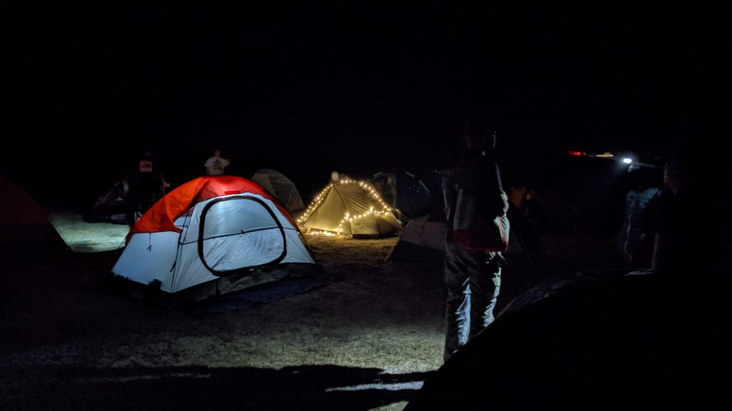 Tents set at night of River Ridge Ranchcamp site