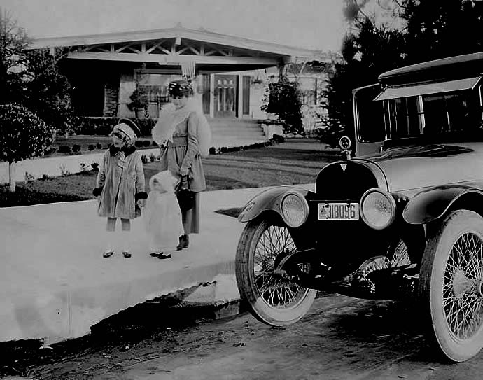 Baby Marie with mother and sister in front of their Long Beach home