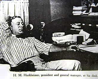 H. M. Horkheimer, President and General manager, at his office desk