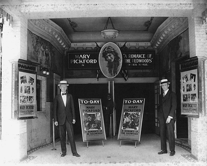 1919 William Fahey and another man at entrance of the Palace Theatre