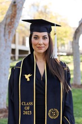 Jenny Canales in graduation cap and gown