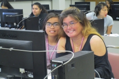 Mother and daughter working on code together